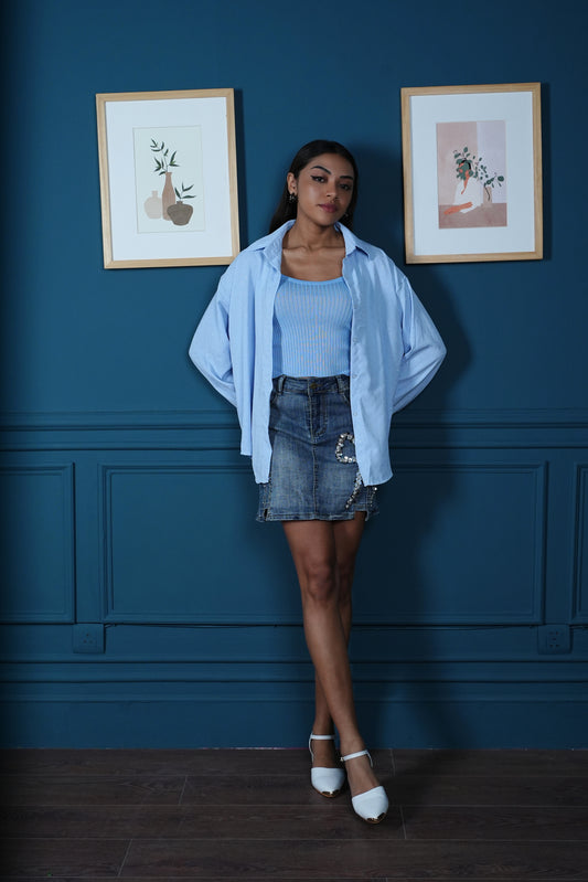 Two piece set with cropped ribbed cami and long oversized studded shirt with high low curved hem