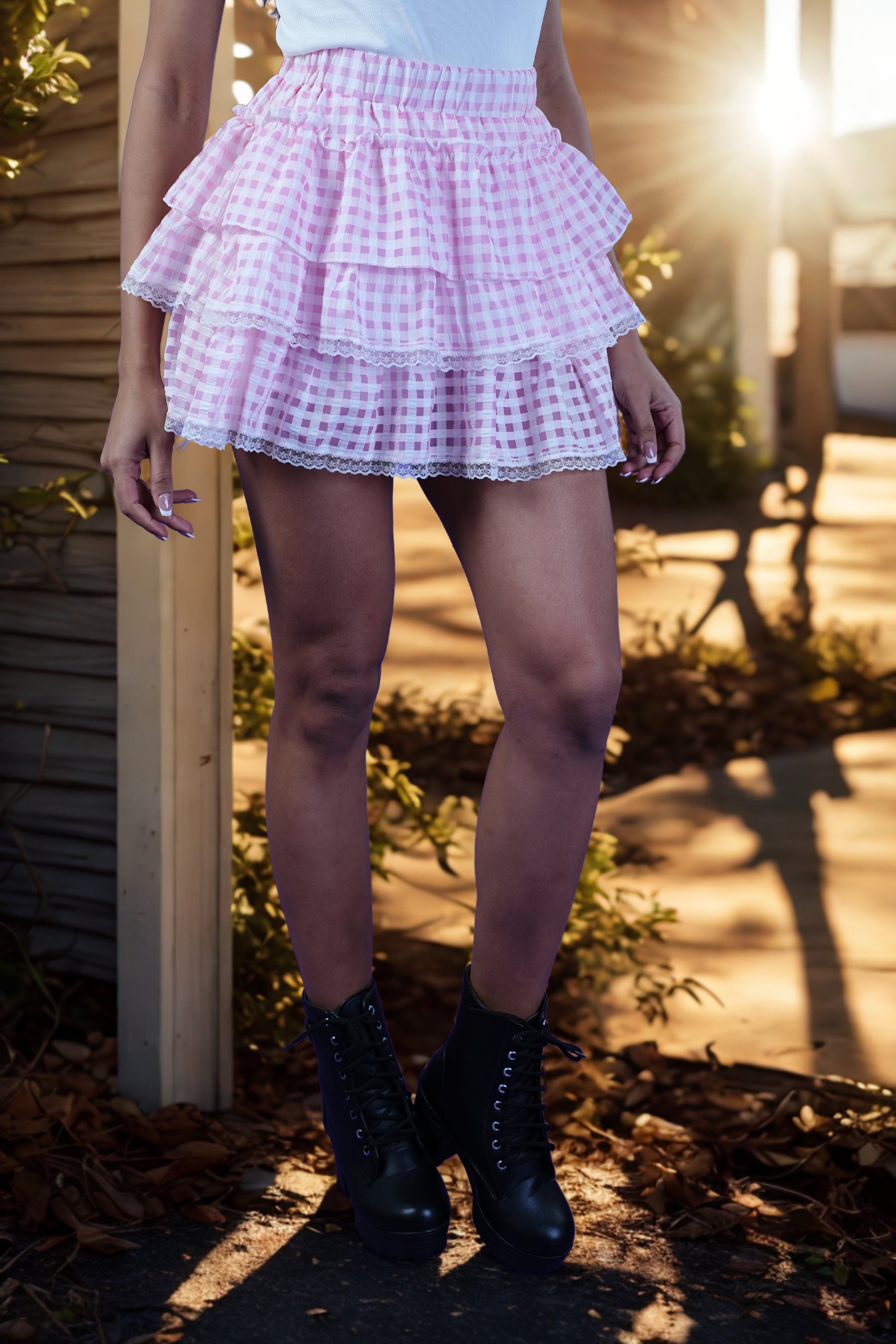 Flared pink check mini skirt with elastic waistband and lace hem detail